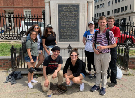 Students post before plaque