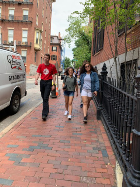 Students walk down street