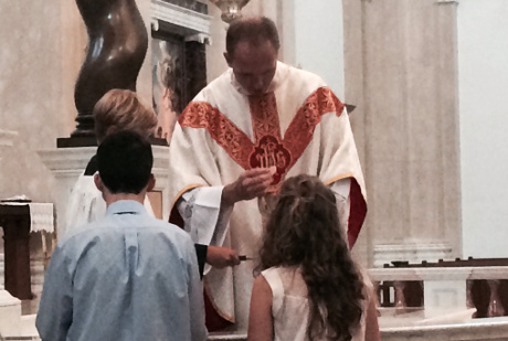 Fr. Nick distributes Holy Communion