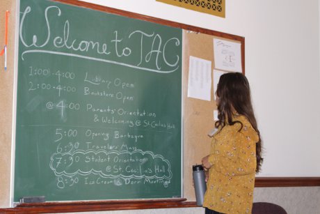 Blackboard reads: Welcome to TAC, with schedule for the firs