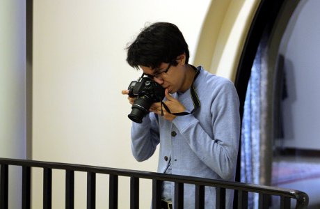 Alberto shoots a photo in the St. Thomas Hall rotunda