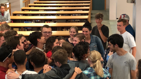Students give Meg a group hug