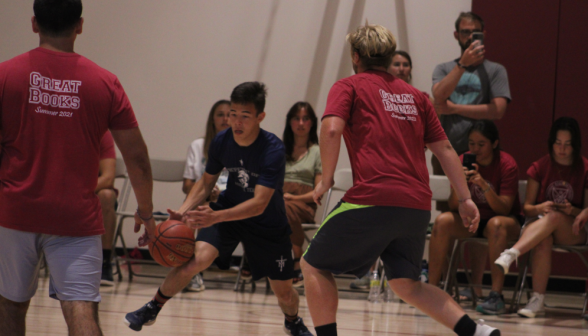 A student dribbles the ball