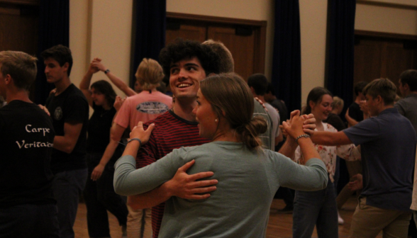 Two students dance a waltz