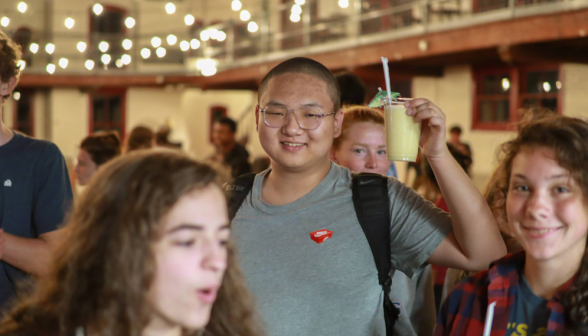 A student poses with his drink