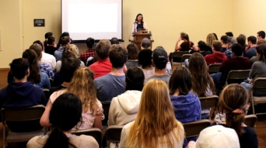 Maggie Tuttle delivers a talk in the Dillon Seminar Room