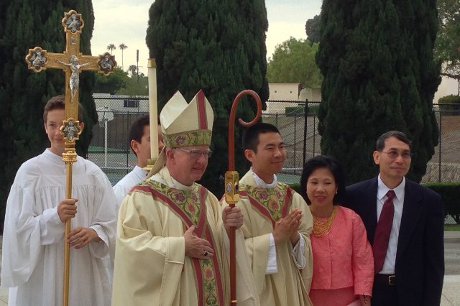 Rev. Jacob (Joseph ’06) Hsieh, O.Praem., with his parents and the Most Rev. Kevin William Vann, Bishop of Orange