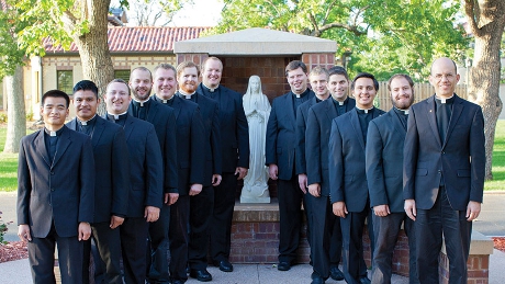 Rev. Gary B Selin, STD (’89, right), with his Denver seminarians