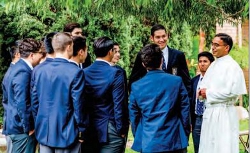 Rev. Mr. Miguel Gaspar Batres, O.Praem (’08) talks to students at St. Michael's Abbey Preparatory School