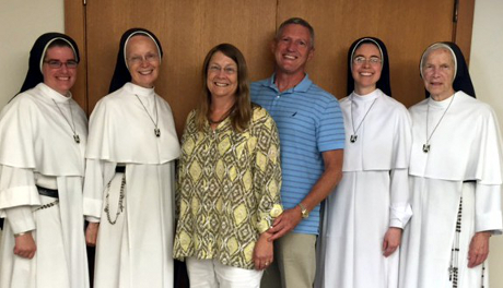 Rose (’76) and Daniel J. Grimm (both ’76) with members of the Dominican Sisters of Mary, Mother of the Eucharist, on a recent fundraising trip