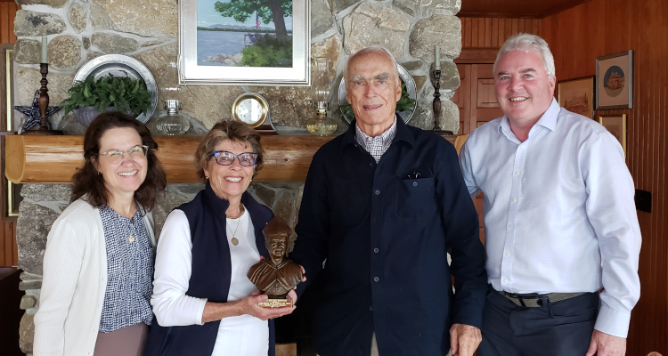 Thomas Aquinas College president Dr. Paul J. O’Reilly (right) and his wife, Peggy (left), present a bust of St. Albert the Great to June and Jack Heffernan.