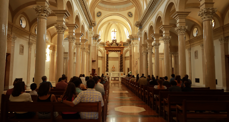 Visitors attend Mass