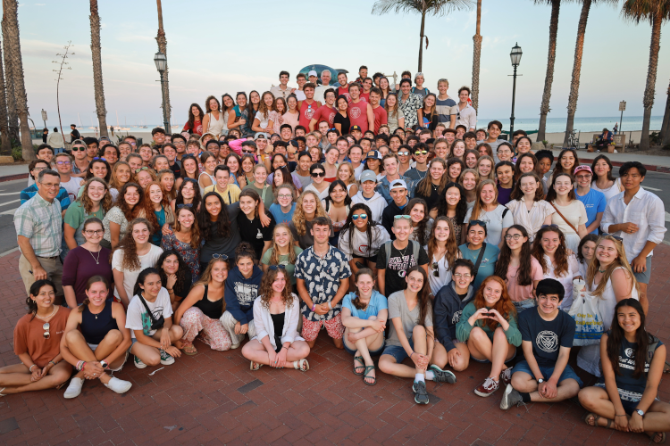 The entire Summer Program poses for a photo afront the dolphin statue