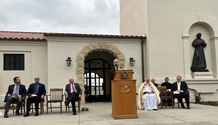 Rex Rawkinson speaks at the dedication of the Pope St. John Paul II Athletic Center