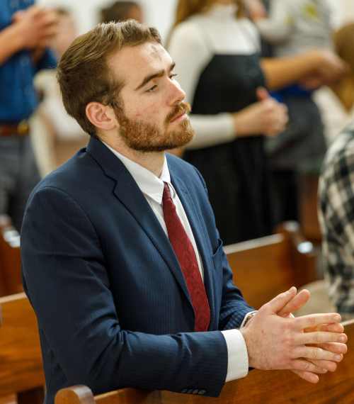 Student prays on Ash Wednesday