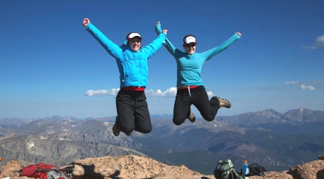 Molly O’Brien (’03, right) adventuring with a friend on a Colorado mountaintop
