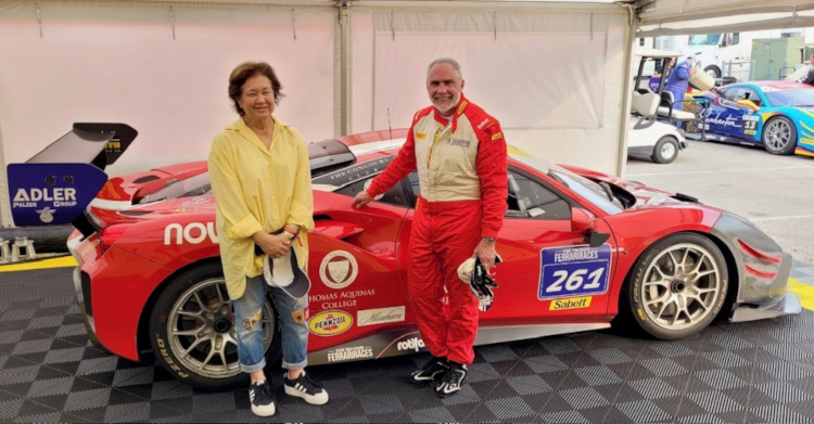 College Governor Berni Neal, her husband, Rob, and their Ferrari 488 EVO racecar, which sports the Thomas Aquinas College crest