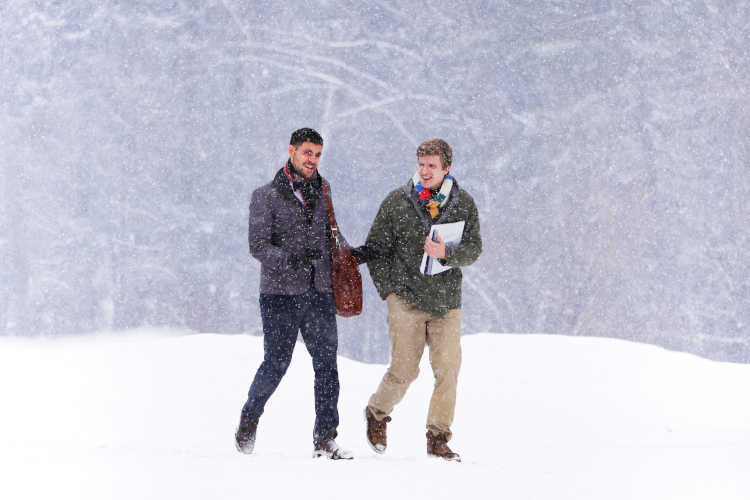 Students walk in the snow