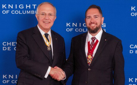 Carl Anderson, supreme knight of the Knights of Columbus, and Patrick Mason (’03), state deputy of the Knight’s New Mexico state council