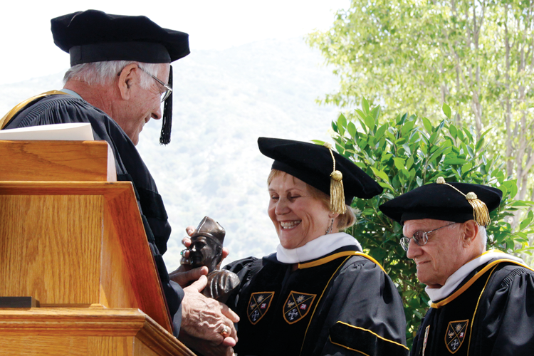 Chairman of the Board of Governors R. James Wensley inducts Carol and Dr. Henry Zeiter into the Order of St. Albert at Commencement 2010.