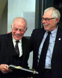 President McLean (right) presents Mr. DeLuca with a photo al
