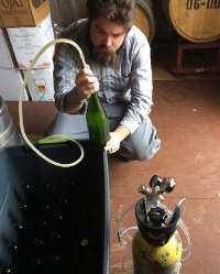 Dominic O’Reilly (’12) bottles a batch of Anna's Cider