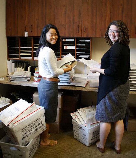 Admission staff prepare the readings for mailing