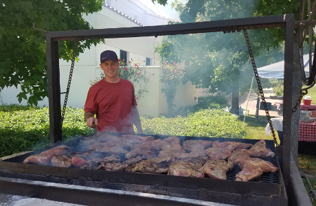 Jon Daly grills the steaks.