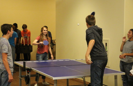 Students play ping-pong