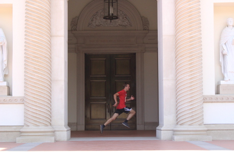 Student runs past Our Lady of the Most Holy Trinity Chapel