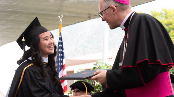 Student receives her diploma