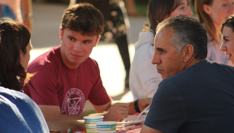 Students and family members get to know one another at the table
