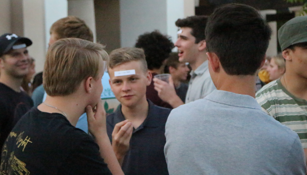 Students play a version of 20 questions to determine the celebrity's name taped to their foreheads