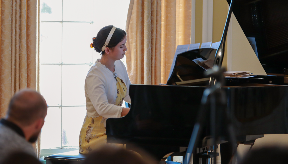 A student performs on the piano