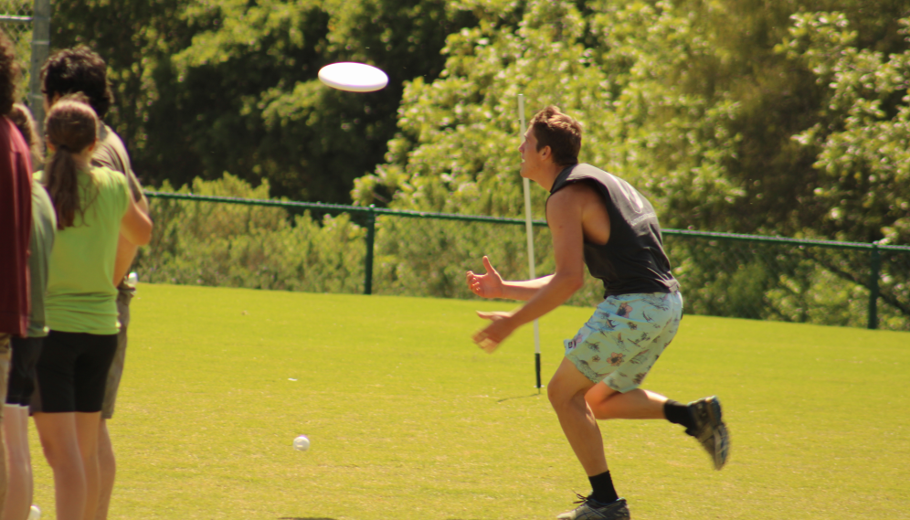 A student about to catch the Frisbee