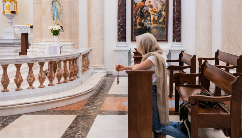 A student prays the Rosary