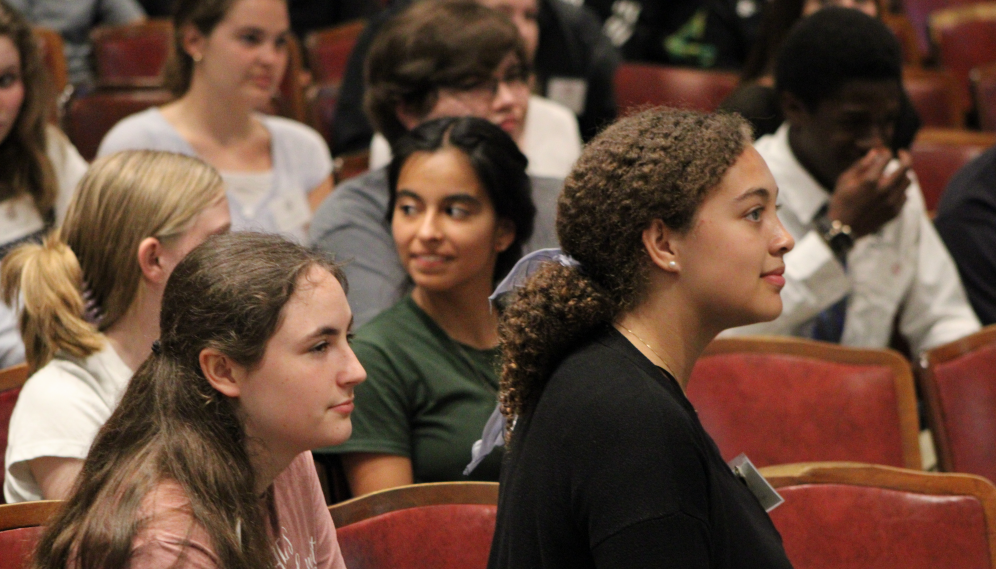 Students sit in the auditorium