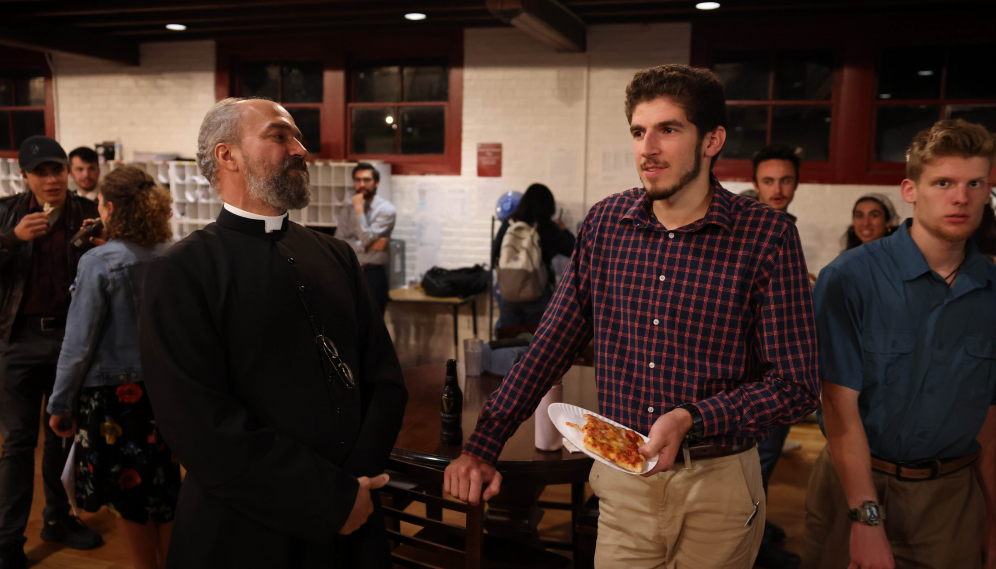 Fr. Viego talks with a freshman