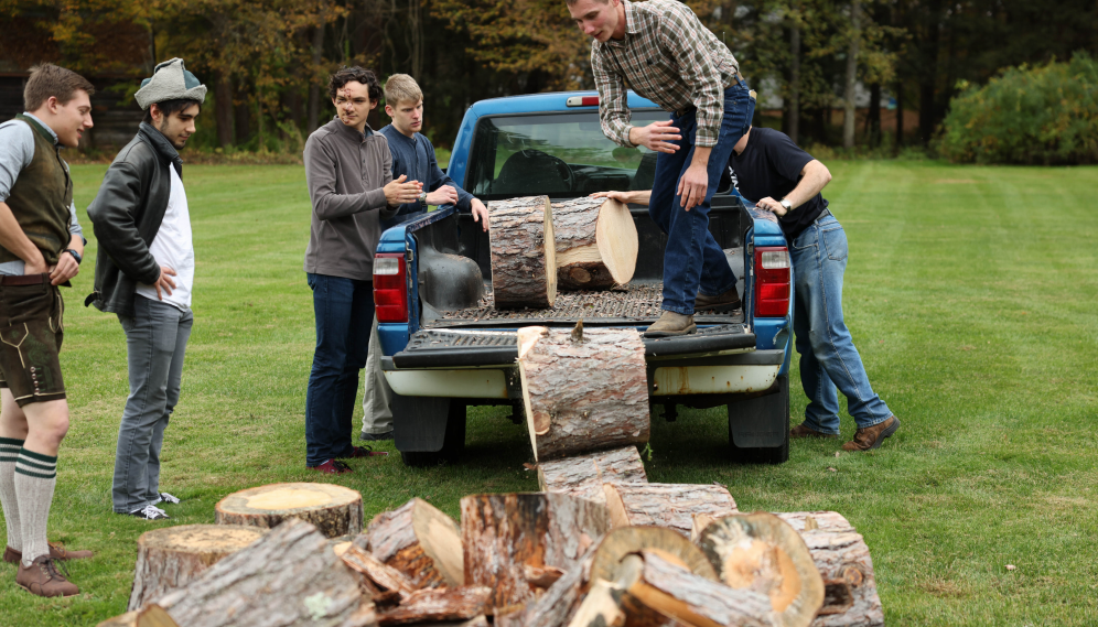 unloading logs from a pickup truck