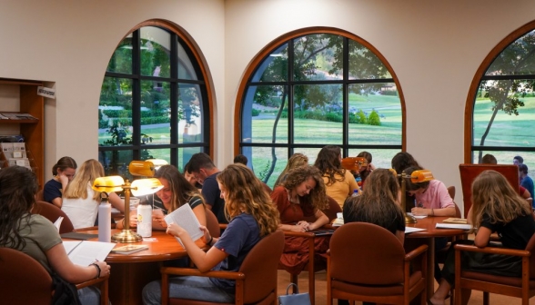 Students fill the tables in the library's left wing