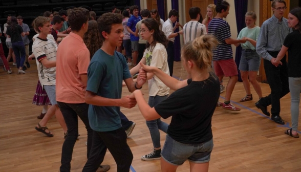 Close-up of two students swing dancing