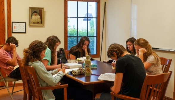 Seven students study in a study room
