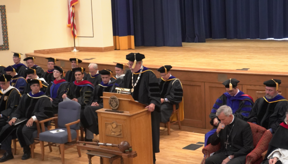 Dr. McLean addresses the students from the podium