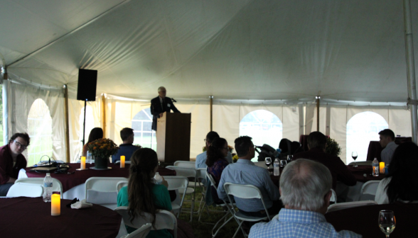 Dr. McLean gives his address at one end of the tent
