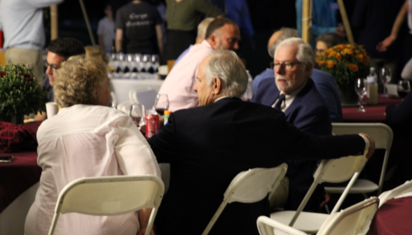 President McLean talks with Dr. Kaiser and Mrs. Kaiser at one of the tables