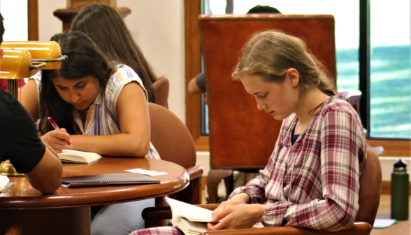 Students study at one of the tables