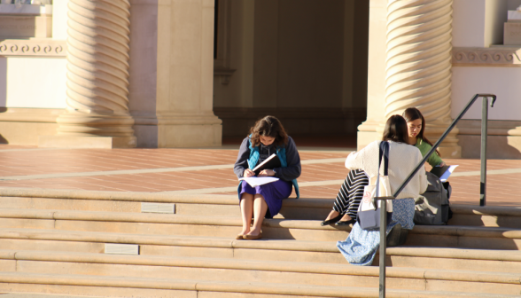 Three studying on the Chapel steps