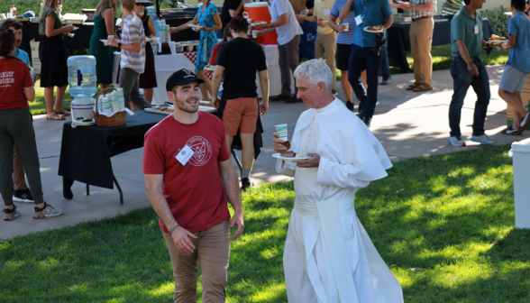 Fr. Walshe talks with a visitor