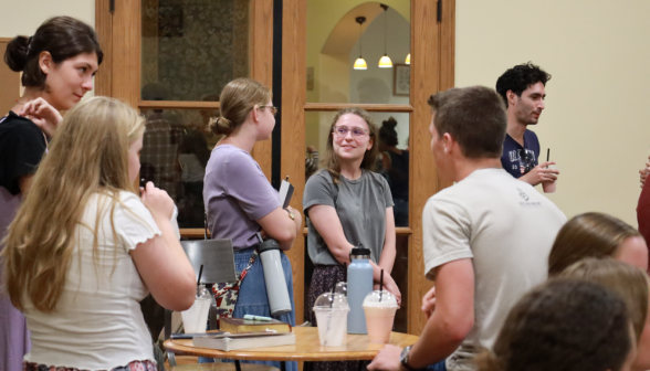 Students chat all around the coffee shop