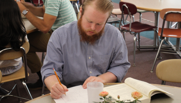 A student studies at a Commons table